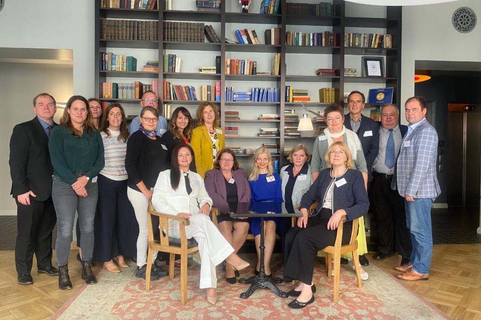 Peer review participants smiling at the camera.